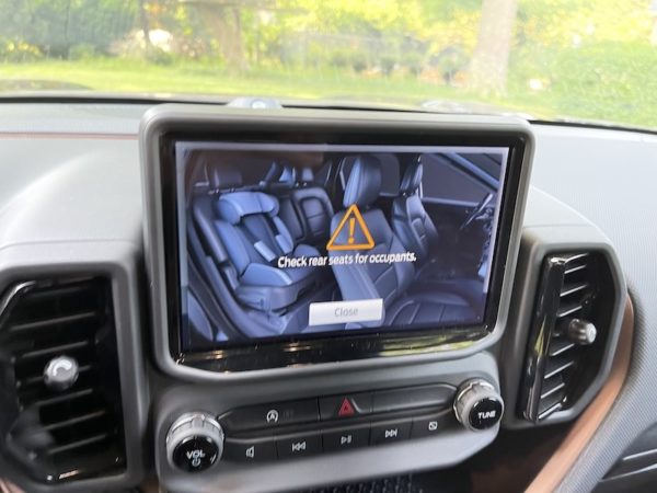 An Image Of The Rear Seat With A Child