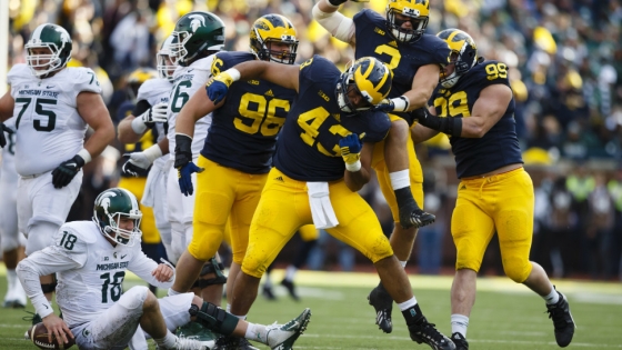 Oct 17, 2015; Ann Arbor, MI, USA; Michigan Wolverines defensive end Chris Wormley (43) celebrates his sack of Michigan State Spartans quarterback Connor Cook (18) in the first half at Michigan Stadium. Mandatory Credit: Rick Osentoski-USA TODAY Sports